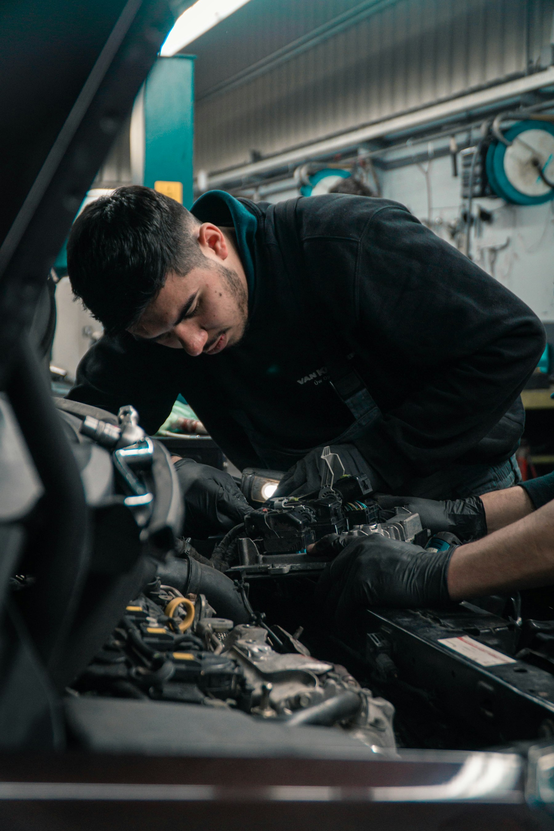 Technician performing vehicle diagnostics