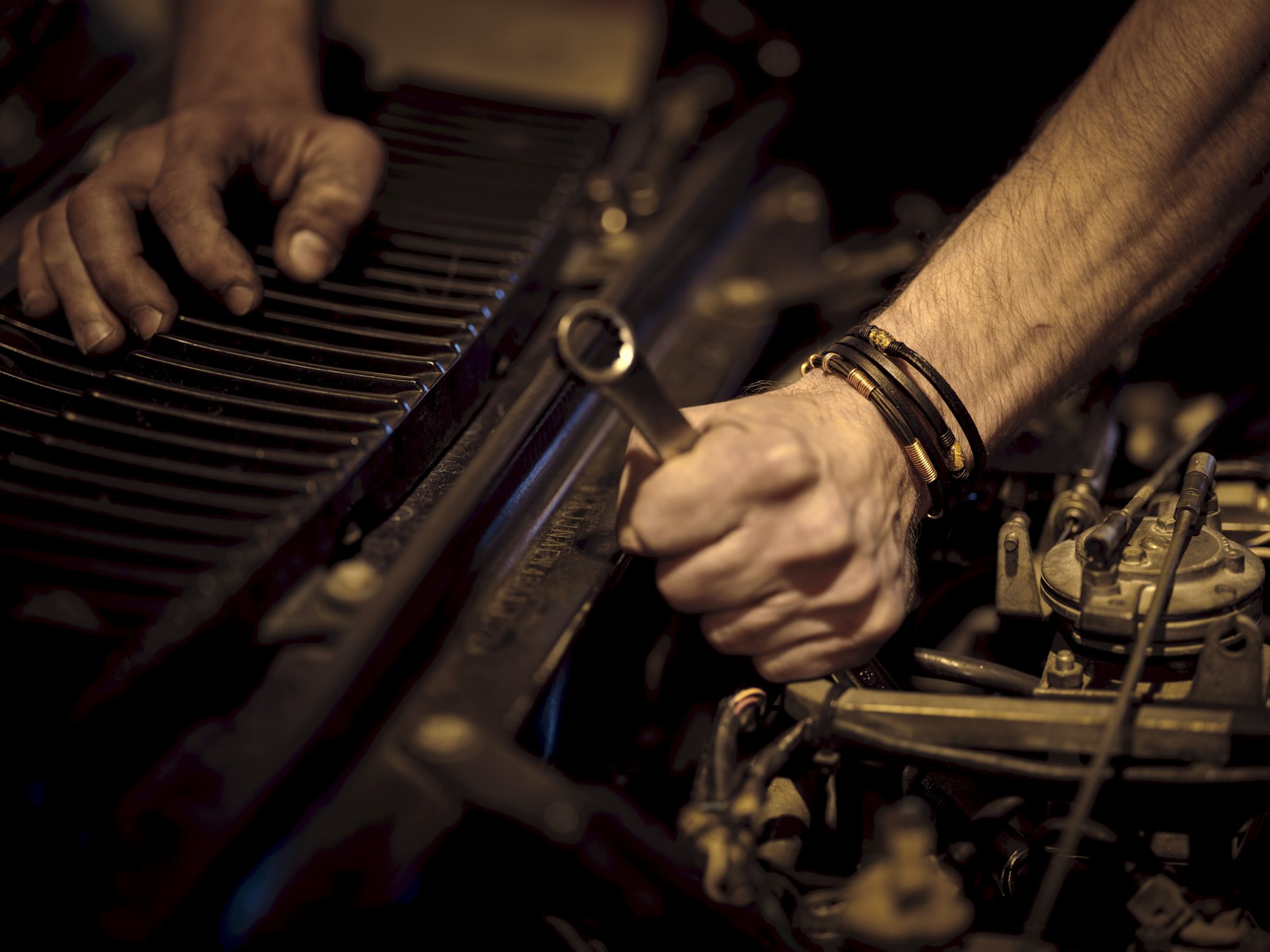 Mechanic working on an engine at Auto Trust Centre