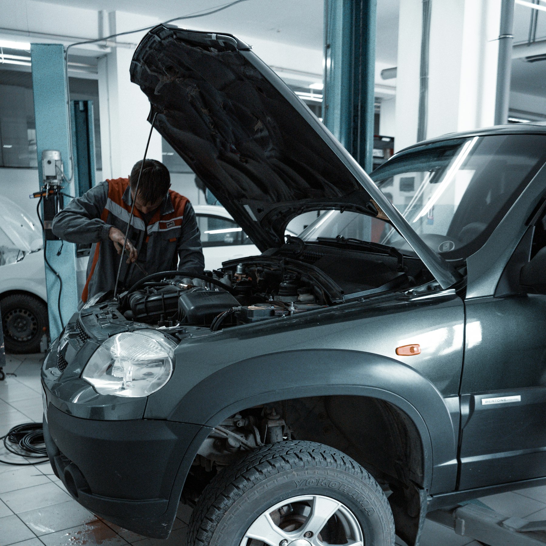 Mechanic servicing a vehicle at Auto Trust Centre in Mississauga